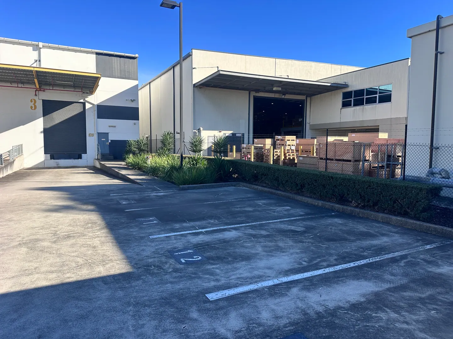 Commercial buildings, paved access and planted borders at a 3Bees client property