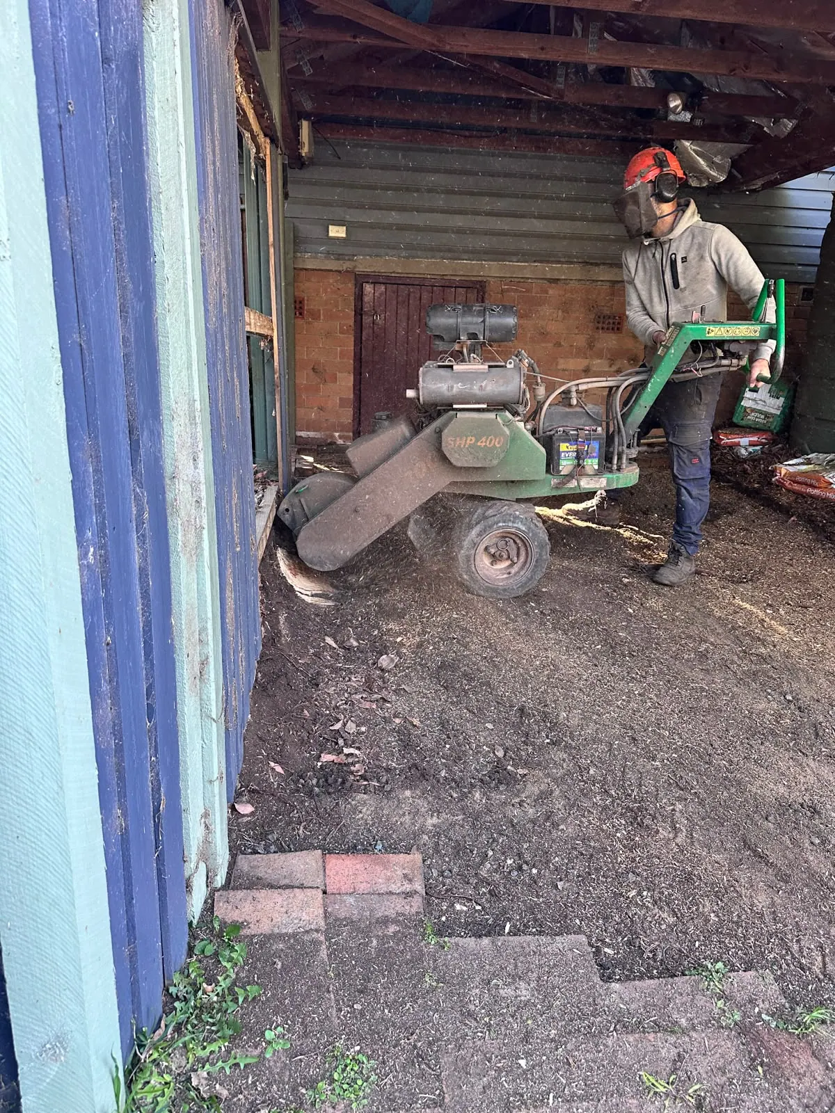 Root grinding after the original carport pavers were lifted