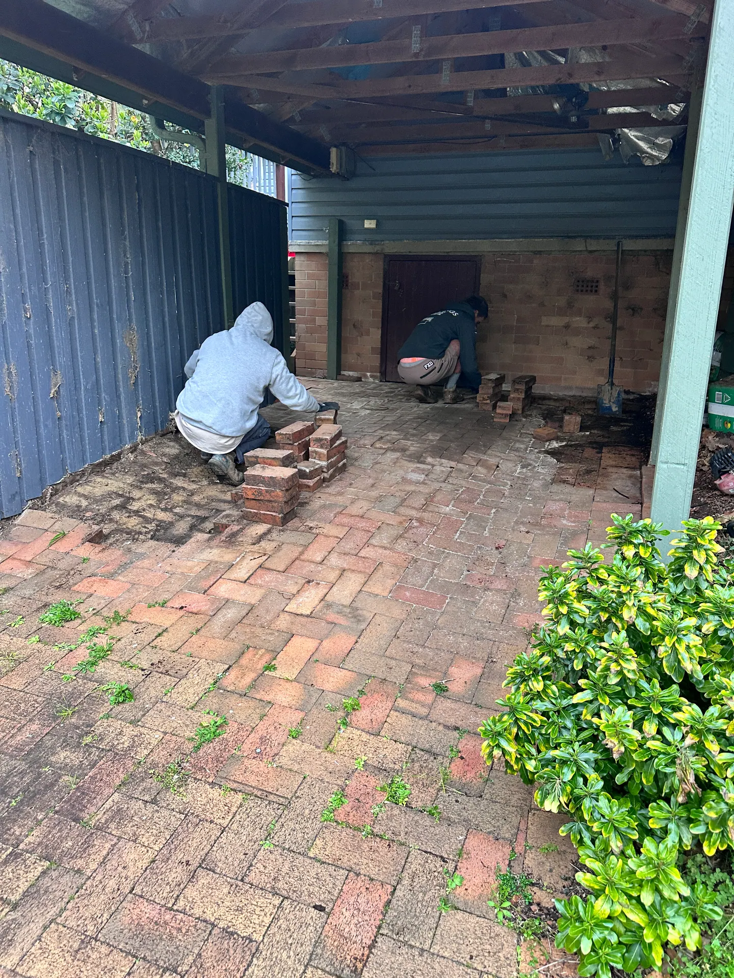 The team working on brick paving at a residential property