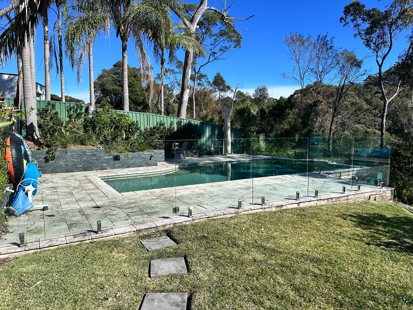 Pool surrounds, paving, lawns and planting at a residential property